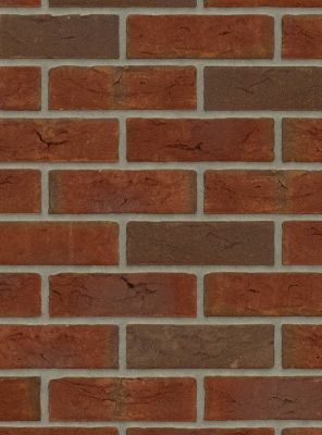 metselstenen dikformaat rood gemetseld in wildverband op een muur