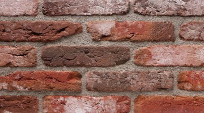 waalformaat metselstenen retro rood op een gemetselde muur
