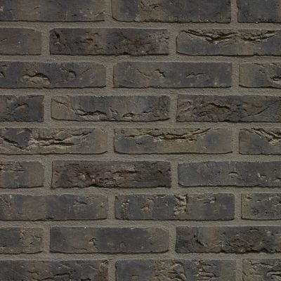 metselstenen waalformaat donkergrijs op een gemetselde buitenmuur